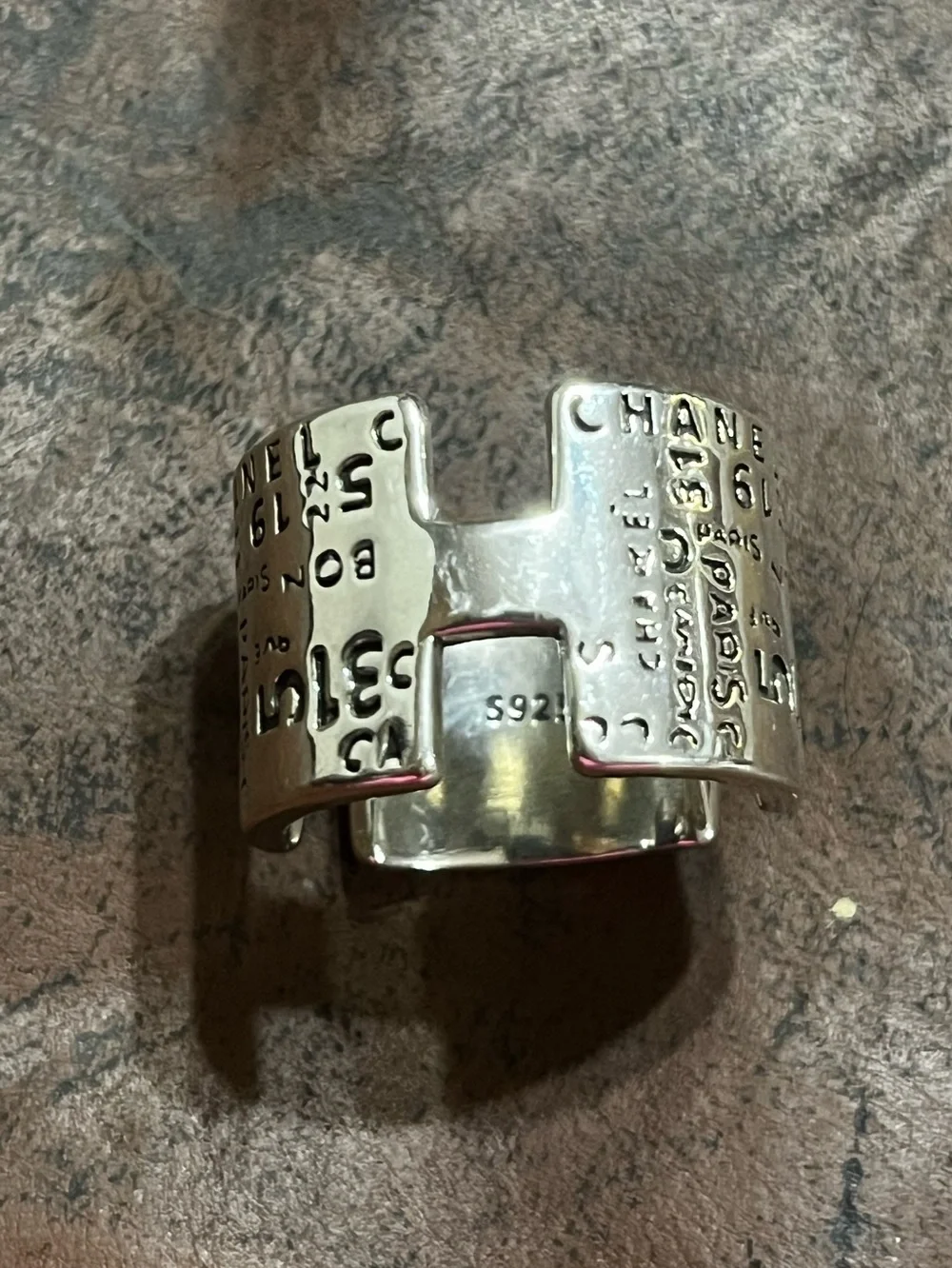 CHANEL Silver Cuff Ring with Embossed Logo
